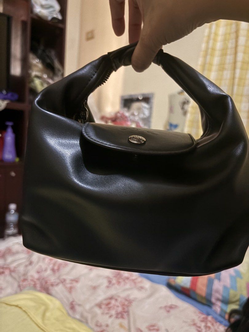 Longchamp Black Leather Handbag (Category: Luxury Bags & Wallets) located in Manila. Submitted by bellepatal57826 (Listing ID 1468533199, Image 1). Description: - Brand: Longchamp - Color: Classic Black - Material: Smooth genuine leather with silver-tone hardware - Closure: Front flap with snap button and secure top zip - Design: Double handle, compact size for daily essentials - Condition: Clean interior and sturdy stitching throughout.