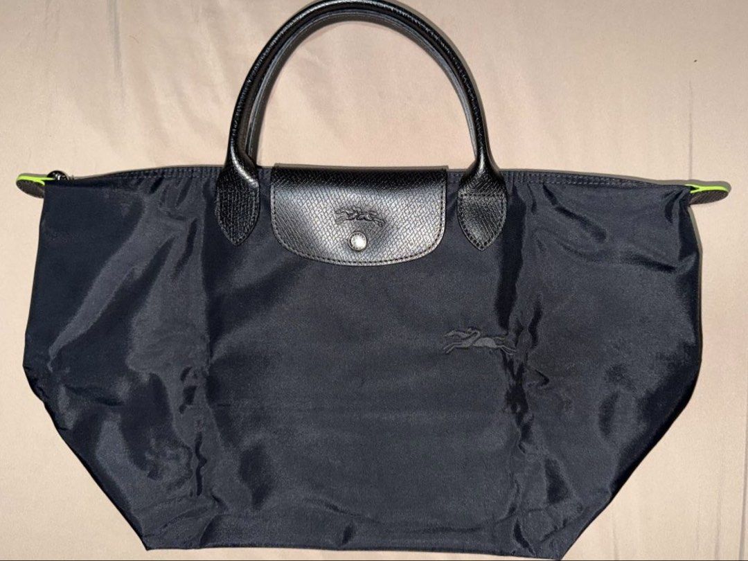 Longchamp Le Pliage Green M Handbag (Category: Luxury Bags & Wallets) located in Taguig. Submitted by j.lax. (Listing ID 1468654947, Image 1). Description: - Authentic Le Pliage Green M Handbag - Color: Black - Condition: Like Brand New.