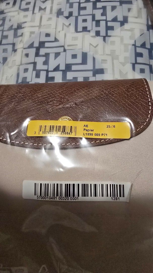 Longchamp Le Pliage Paper Tote Bag (Category: Luxury Bags & Wallets) located in Las Pinas. Submitted by insouciant_worrier (Listing ID 1468623522, Image 2). Description: Slightly negotiable - Authentic Longchamp Le Pliage Tote Bag in Papier (Style Code: L1899089P71) - Brand new, unopened in original packaging - Includes original store tags from Rustan's and branded dust bag - Signature brown leather handles and flap with snap button closure - Spa