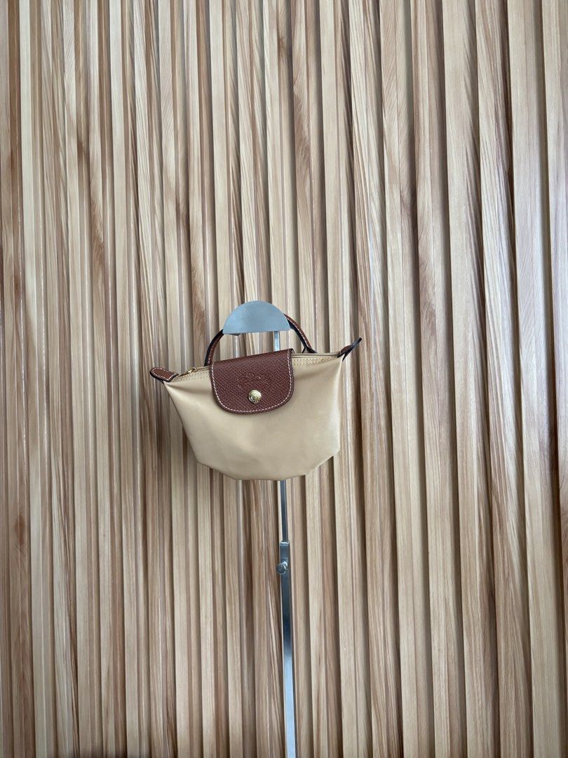 LONGCHAMP LE PLIAGE POUCH IN CHAMOISE (Category: Luxury Bags & Wallets) located in Imus. Submitted by dumpitlikeaqueen (Listing ID 1468512942, Image 3). Description: • Store-bought at Longchamp, LUXE Duty Free • With care card, zip plastic & LUXE paper bag • Open for layaway • Instagram Shop: @dumpitlikeaqueen.