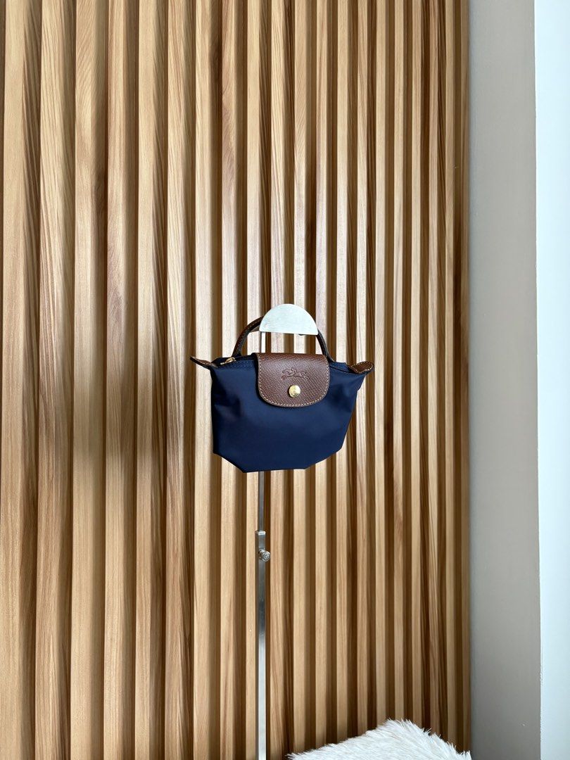 LONGCHAMP LE PLIAGE POUCH IN MARINE (Category: Luxury Bags & Wallets) located in Imus. Submitted by dumpitlikeaqueen (Listing ID 1468512654, Image 2). Description: • Store-bought at Longchamp, LUXE Duty Free • With care card, zip plastic & LUXE paper bag • Open for layaway • Instagram Shop: @dumpitlikeaqueen.
