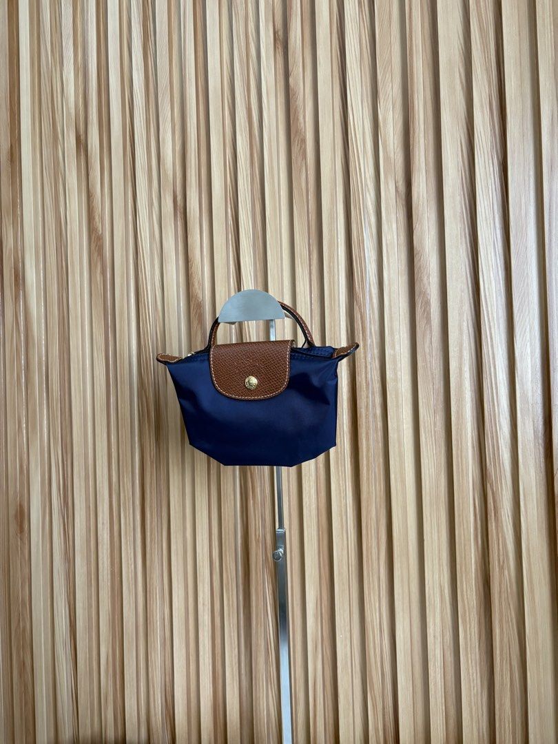 LONGCHAMP LE PLIAGE POUCH IN MARINE (Category: Luxury Bags & Wallets) located in Imus. Submitted by dumpitlikeaqueen (Listing ID 1468512654, Image 3). Description: • Store-bought at Longchamp, LUXE Duty Free • With care card, zip plastic & LUXE paper bag • Open for layaway • Instagram Shop: @dumpitlikeaqueen.
