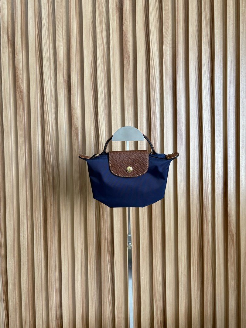 LONGCHAMP LE PLIAGE POUCH IN MARINE (Category: Luxury Bags & Wallets) located in Imus. Submitted by dumpitlikeaqueen (Listing ID 1468512654, Image 1). Description: • Store-bought at Longchamp, LUXE Duty Free • With care card, zip plastic & LUXE paper bag • Open for layaway • Instagram Shop: @dumpitlikeaqueen.