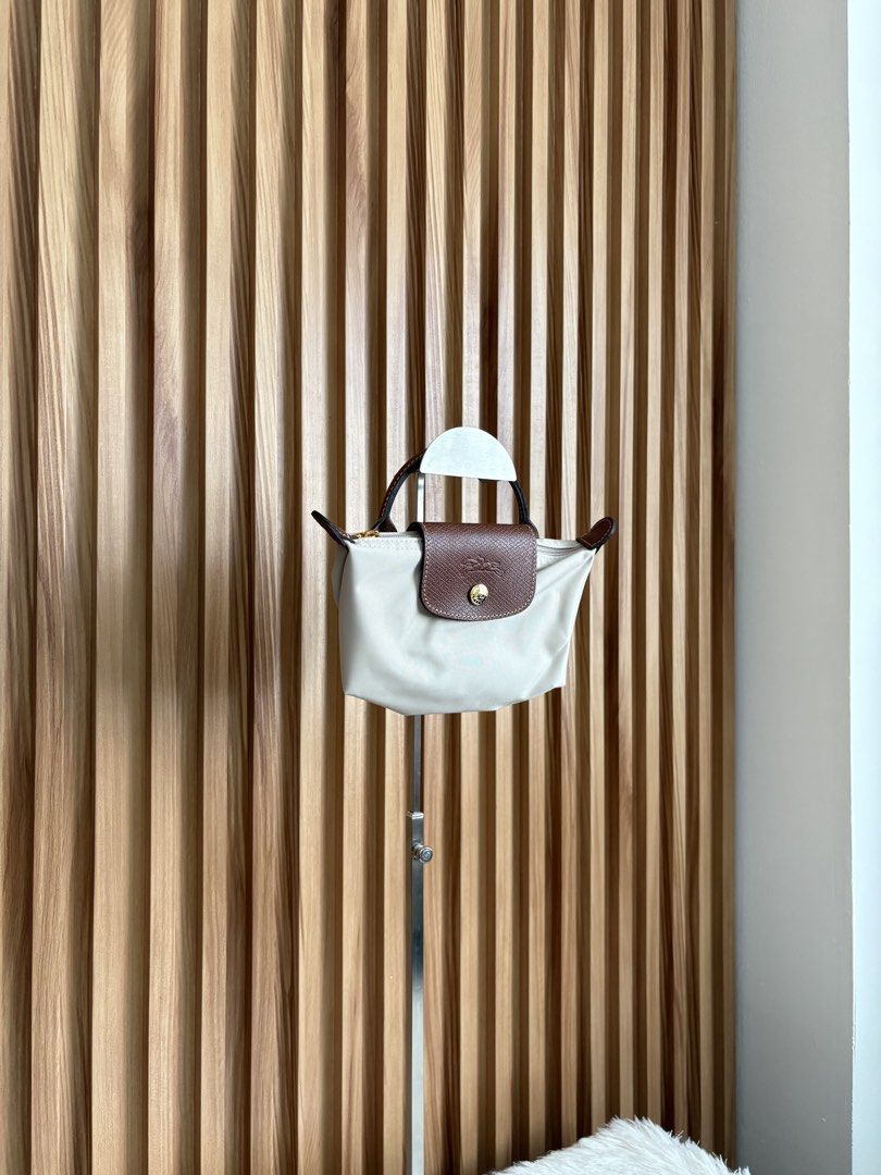 LONGCHAMP LE PLIAGE POUCH IN PAPIER (Category: Luxury Bags & Wallets) located in Imus. Submitted by dumpitlikeaqueen (Listing ID 1468512444, Image 2). Description: • Store-bought at Longchamp, LUXE Duty Free • With care card, zip plastic & LUXE paper bag • Open for layaway • Instagram Shop: @dumpitlikeaqueen.