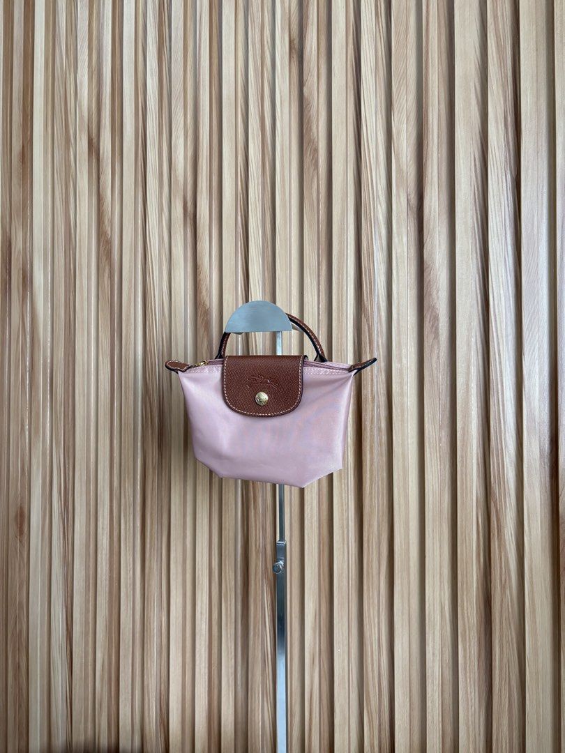 LONGCHAMP LE PLIAGE POUCH IN ROSETHÉ (Category: Luxury Bags & Wallets) located in Imus. Submitted by dumpitlikeaqueen (Listing ID 1468512786, Image 3). Description: • Store-bought at Longchamp, LUXE Duty Free • With care card, zip plastic & LUXE paper bag • Open for layaway • Instagram Shop: @dumpitlikeaqueen.