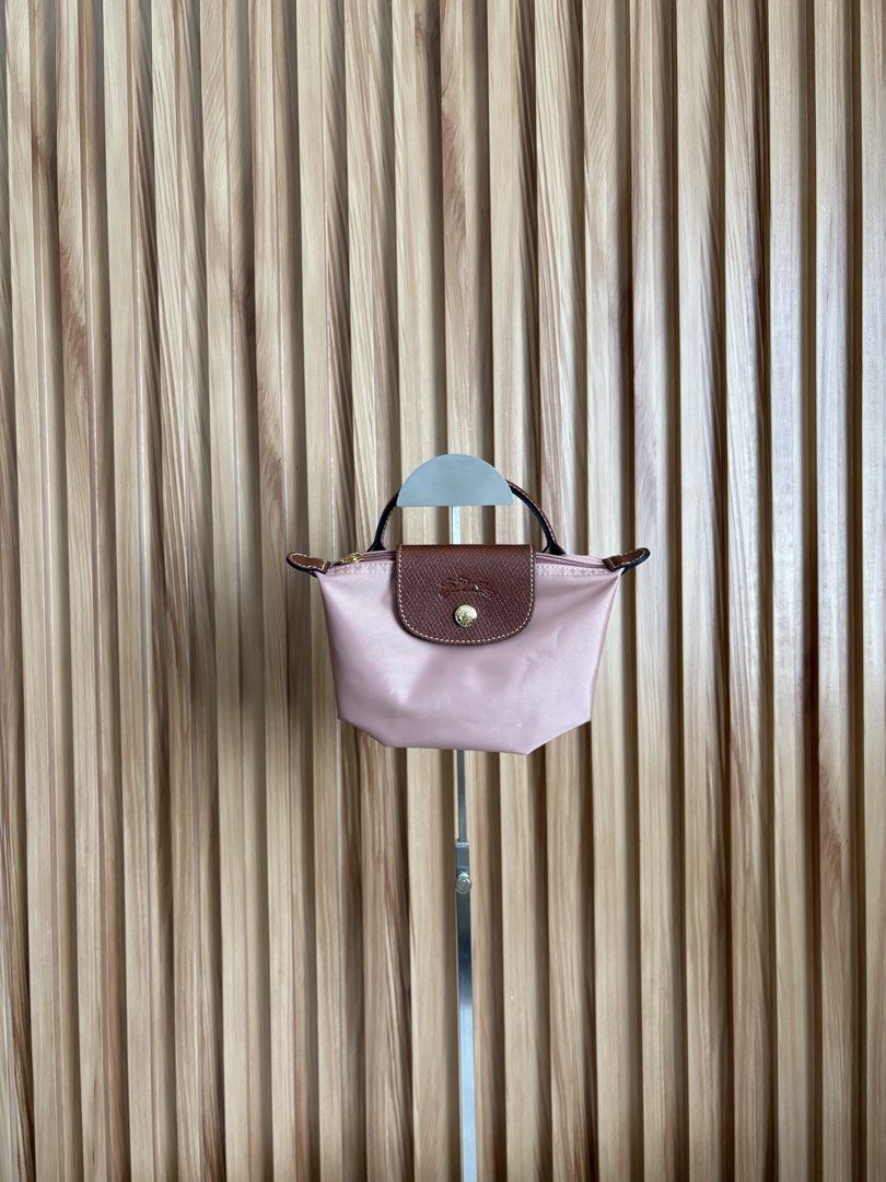 LONGCHAMP LE PLIAGE POUCH IN ROSETHÉ (Category: Luxury Bags & Wallets) located in Imus. Submitted by dumpitlikeaqueen (Listing ID 1468512786, Image 1). Description: • Store-bought at Longchamp, LUXE Duty Free • With care card, zip plastic & LUXE paper bag • Open for layaway • Instagram Shop: @dumpitlikeaqueen.