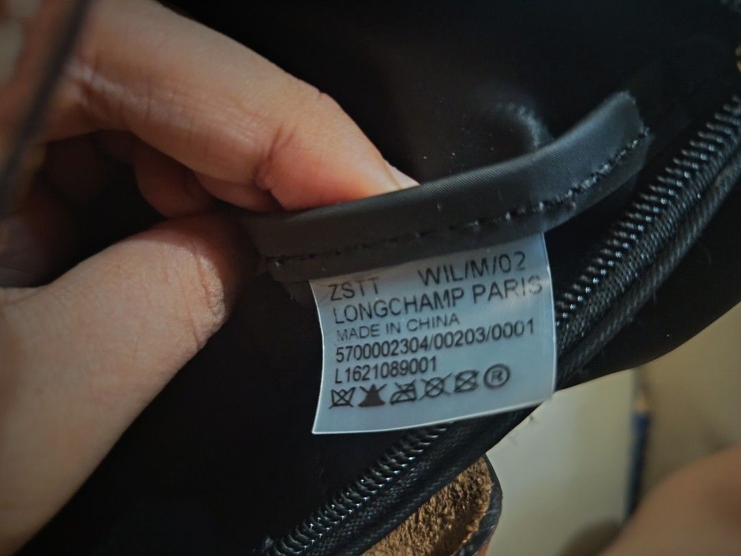 Longchamp Le Pliage Short Handle Tote Bag Black (Category: Luxury Bags & Wallets) located in Candelaria. Submitted by cestlovie (Listing ID 1468667568, Image 3). Description: -Liked new mabango - You can self authentic it - Preloved from Japan - Brand: Longchamp Le Pliage - Color: Classic black with brown leather flap and handles - Hardware: Gold-tone snap button and zipper pull - Material: Durable, lightweight, and foldable nylon body - Conditio