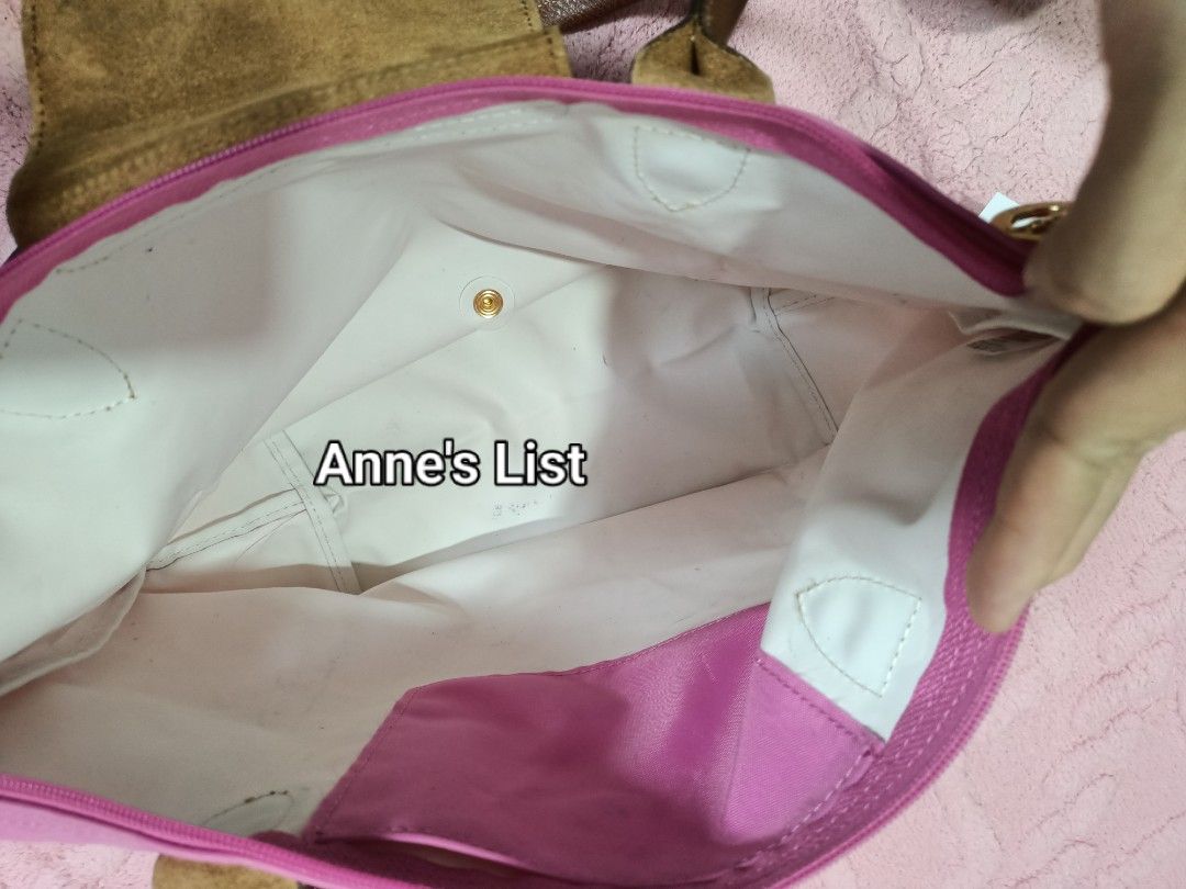Longchamp Pink Tote Long Handle Bag (Category: Luxury Bags & Wallets) located in Santa Maria. Submitted by anne_s.list (Listing ID 1468685065, Image 3). Description: - Brand: Longchamp - Color: Bright pink nylon with brown leather handles and flap - Hardware: Gold-tone snap closure - Closure: Zip top opening - Interior: White fabric lining with 1 slip pocket - Style: Classic everyday shoulder bag - Condition: Excellent pre-loved condition - No Re