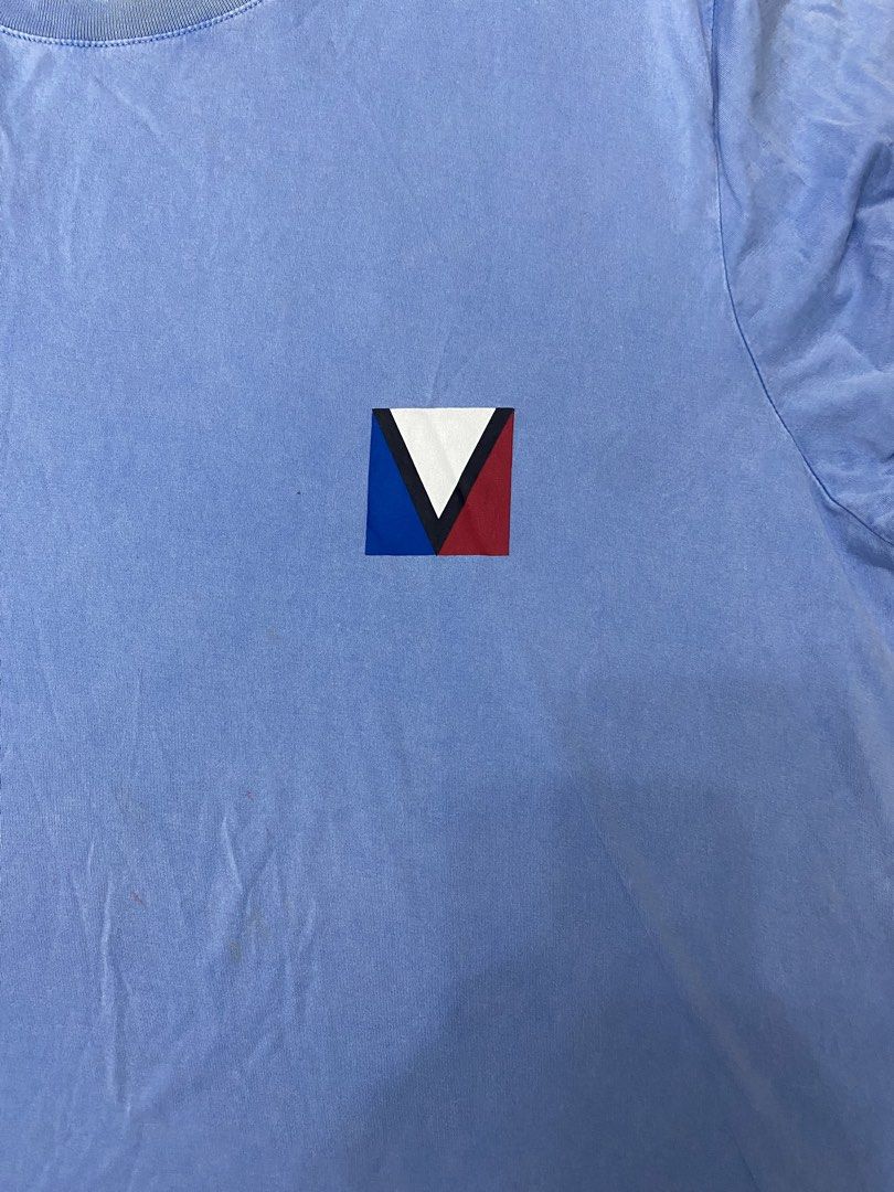 Louis Vuitton Blue Graphic Tee (Category: Tshirts & Polo Shirts ) located in Paranaque City. Submitted by axie1206 (Listing ID 1468585874, Image 1). Description: - Brand: Louis Vuitton - Color: Light blue with colorblock V logo patch - Material: Soft, premium cotton with casual wash finish - Design: Classic crew neck, short sleeves, interior dark brown brand label - Style: Simple, versatile everyday designer piece - Shipping: Fast shipping via J&