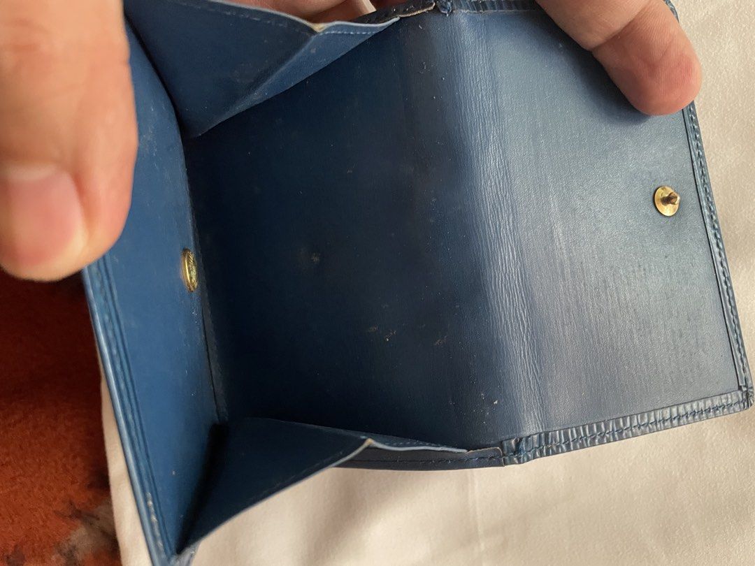 Louis Vuitton Epi Leather Blue Wallet (Category: Luxury Bags & Wallets) located in Mandaluyong City. Submitted by jetzkypreloveditems (Listing ID 1468619030, Image 2). Description: - 100% Authentic Louis Vuitton Epi leather wallet in a classic blue shade - Features the iconic textured wavy grain pattern and subtle embossed LV initials - Secure snap-button closure opens to practical bill compartments and a coin pocket - Pre-loved condition with he