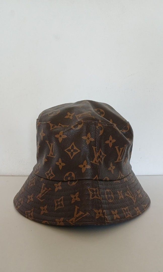 Louis Vuitton Monogram Bucket Hat (Category: Hats & Beanies) located in Batangas. Submitted by thriftshop_izy15 (Listing ID 1468564658, Image 1). Description: - Brand: Louis Vuitton - Color: Classic Brown - Material/Design: All-over signature monogram canvas print - Features: Structured brim, branded interior fabric label, and care tag - Condition: Brand new with attached store tag on string loop - Style: Timeless bucket hat design.
