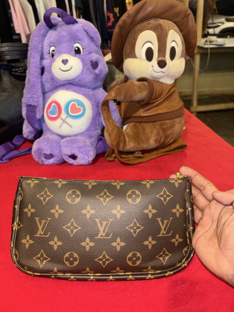 Louis Vuitton Monogram Canvas Pouch (Category: Luxury Bags & Wallets) located in Manila. Submitted by jeromskito66462 (Listing ID 1468669471, Image 2). Description: - Authentic Louis Vuitton Monogram Canvas Pouch - Classic brown exterior with iconic LV logo and gold-tone hardware - Clean brown fabric interior lining equipped with a convenient slip pocket - Features the official leather tab label stamped "Louis Vuitton Paris, Made in France" - Exc