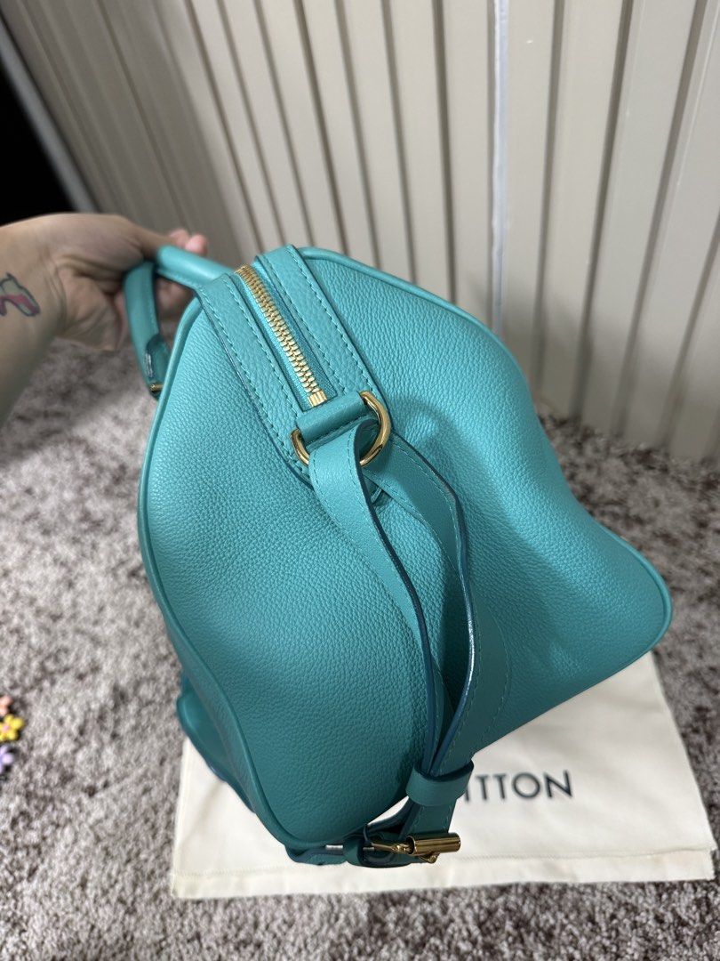 Louis Vuitton SC Bag PM Turquoise (Category: Luxury Bags & Wallets) located in Quezon City. Submitted by jakalalo22 (Listing ID 1468711635, Image 3). Description: - Brand: Louis Vuitton - Model: SC Bag PM (M94018) - Color/Material: Turquoise Veau Sofia pebble-grained leather - Hardware: Gold-tone with protective bottom studs - Handles/Strap: Double top handles and detachable shoulder strap - Closure: Secure top zip closure - Inclusions: Original 