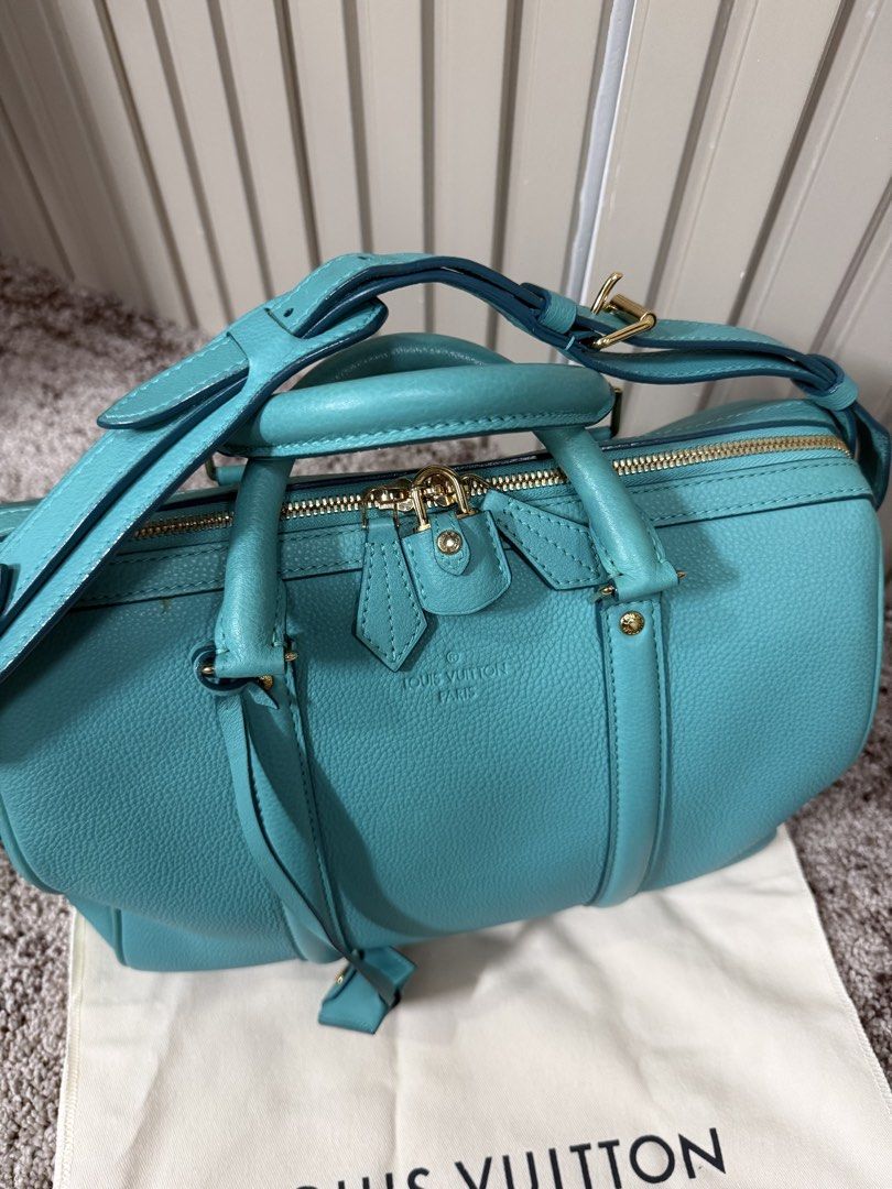 Louis Vuitton SC Bag PM Turquoise (Category: Luxury Bags & Wallets) located in Quezon City. Submitted by jakalalo22 (Listing ID 1468711635, Image 2). Description: - Brand: Louis Vuitton - Model: SC Bag PM (M94018) - Color/Material: Turquoise Veau Sofia pebble-grained leather - Hardware: Gold-tone with protective bottom studs - Handles/Strap: Double top handles and detachable shoulder strap - Closure: Secure top zip closure - Inclusions: Original 
