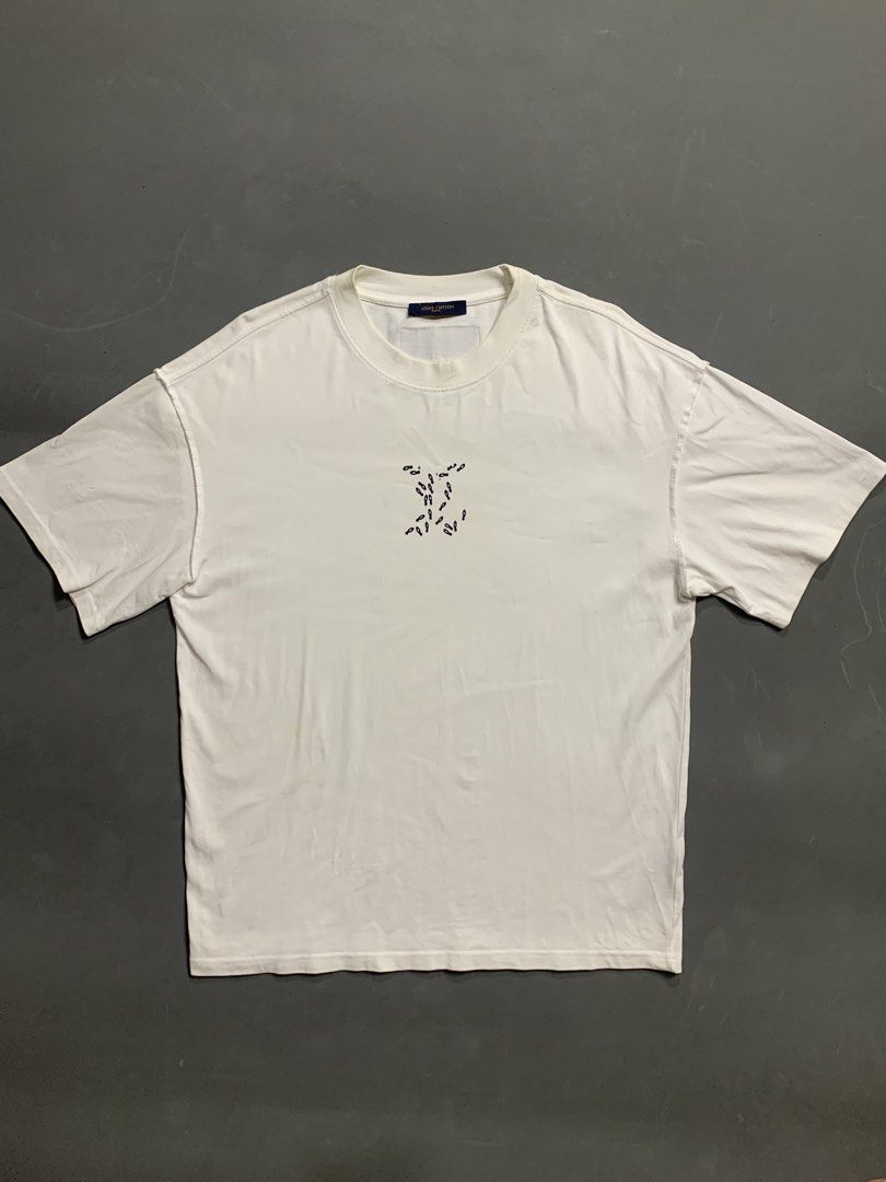 Louis Vuitton Virgil Abloh Graphic Tee White (Category: Tshirts & Polo Shirts ) located in Kalibo. Submitted by gneiss2002 (Listing ID 1468527842, Image 2). Description: - Brand: Louis Vuitton (Virgil Abloh Collection) - Color: White - Fit: Relaxed fit with short sleeves and classic crew neck - Design: Large detailed sketch graphic printed on the back - Details: Signature brown leather label stitched near the neckline - Style: Great statement pie
