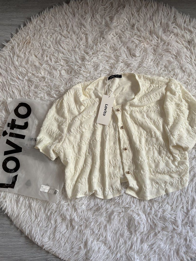 Lovito White Textured Button Cardigan Size XL (Category: Coats, Jackets and Outerwear) located in Quezon City. Submitted by lovedbysloane (Listing ID 1468576365, Image 1). Description: - Brand: Lovito - Size: XL (Standard fit) - Color: White - Material: Lightweight, textured crinkled fabric - Details: Button-down front with round metallic buttons - Condition: Brand new with original brand tags and packaging bag - Style: Versatile and easy to matc