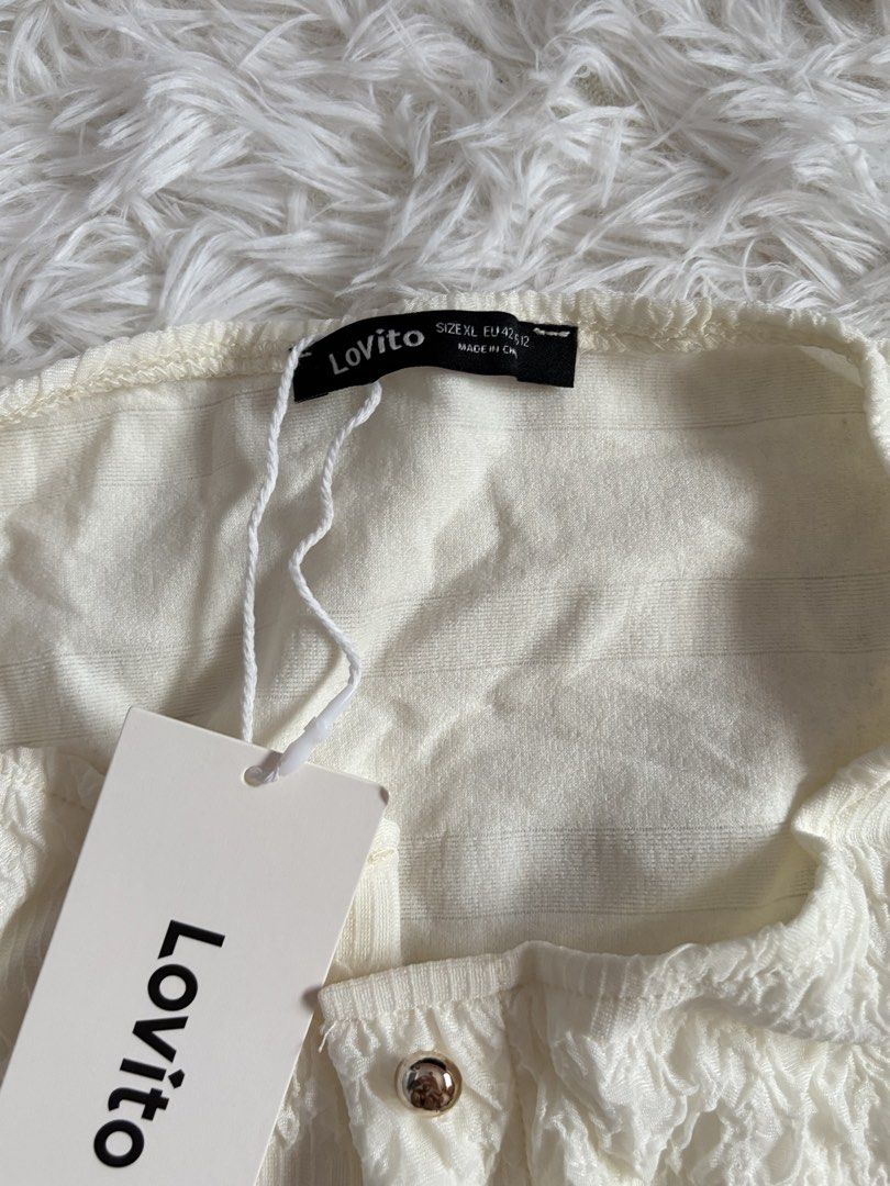 Lovito White Textured Button Cardigan Size XL (Category: Coats, Jackets and Outerwear) located in Quezon City. Submitted by lovedbysloane (Listing ID 1468576365, Image 2). Description: - Brand: Lovito - Size: XL (Standard fit) - Color: White - Material: Lightweight, textured crinkled fabric - Details: Button-down front with round metallic buttons - Condition: Brand new with original brand tags and packaging bag - Style: Versatile and easy to matc