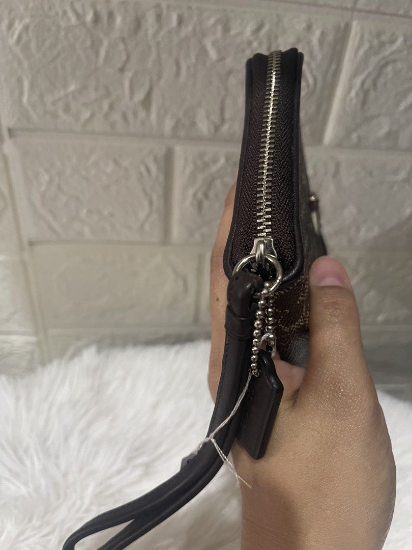 ❗️LP❗️Coach wallet wrislet (Category: Purses & Pouches) located in Naga. Submitted by luxx_clover (Listing ID 1468566797, Image 2). Description: made in India - signs of use only - no flaw.