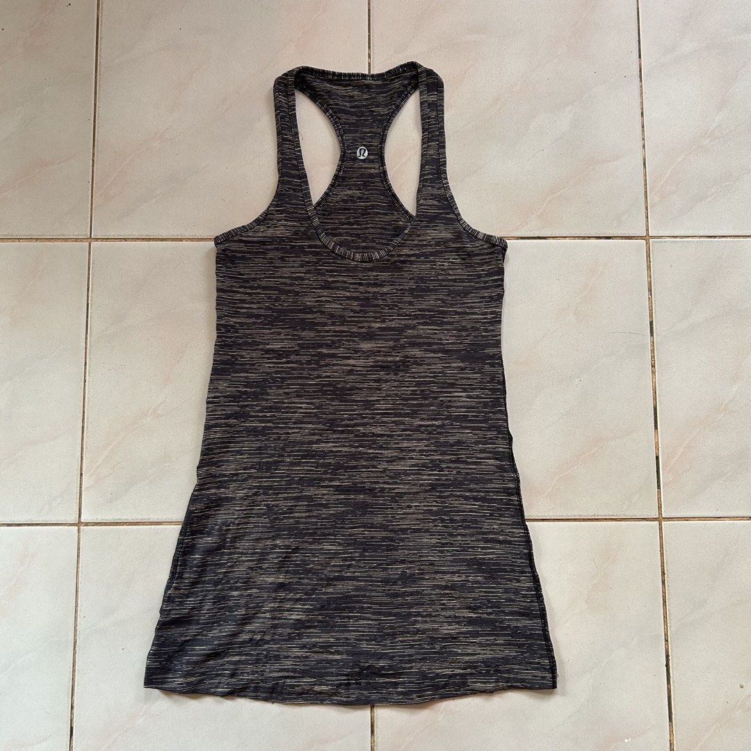 Lululemon Athletic Tank Top 🥰 (Category: Sleeveless) located in Jinoba-an. Submitted by eegiboy (Listing ID 1468536224, Image 1). Description: - Brand: Lululemon - Design: Black & grey space dye pattern with scoop neckline and classic racerback - Details: Signature silver reflective logo at the upper back - Material: Soft, stretchy, and breathable fabric - Versatility: Ideal for yoga, gym workouts, or daily casual styling - Condition: Excellent 