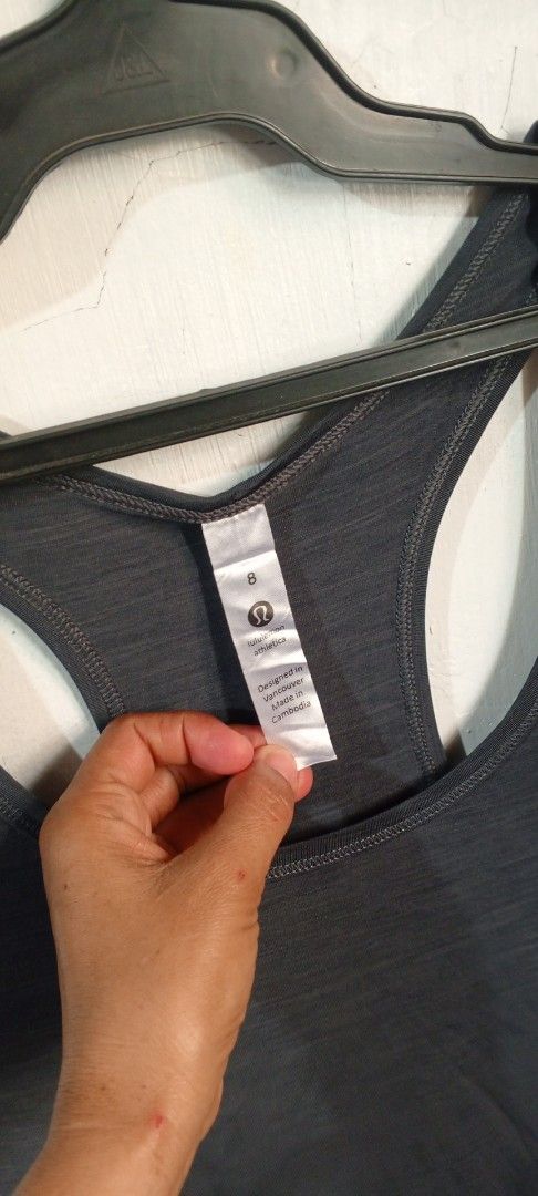 Lululemon Athletic Tank Top Grey Size 8 (Category: Sleeveless) located in Manila. Submitted by ezekislacl02490 (Listing ID 1468588820, Image 2). Description: - Brand: lululemon athletica - Color: Dark grey heathered - Size: 8 - Style: Racerback with curved hem - Details: Small reflective lululemon logo on upper back - Fabric: Lightweight and breathable - Ideal for: Workouts, running, or casual everyday wear - Condition: Great pre-loved condition.
