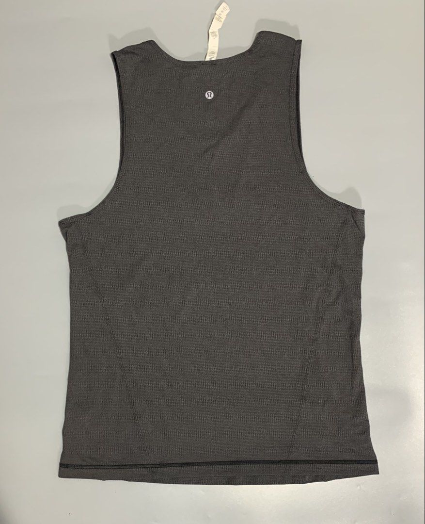 Lululemon Athletic Tank Top Size M Grey (Category: Activewear) located in Cebu City. Submitted by stuff_paid (Listing ID 1468639560, Image 2). Description: - Brand: Lululemon - Style: Sleeveless athletic pullover tank top - Color: Grey - Size: M - Material: High-performance blend (Nylon, Polyester, Lycra Elastane, and X-Static Nylon) - Details: Classic reflective Lululemon logo printed on the upper back - Condition: Clean fabric texture, excellen
