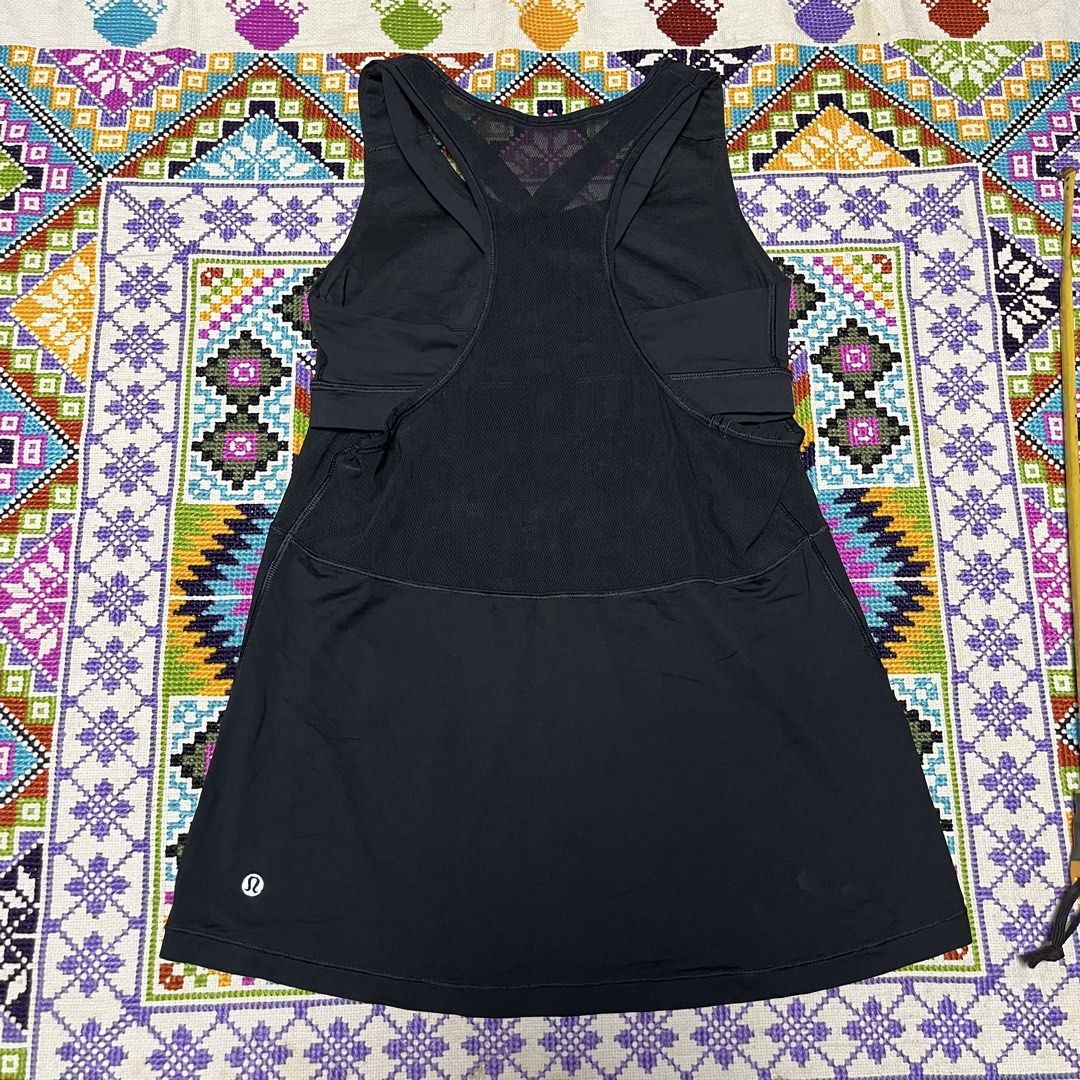 Lululemon Black Mesh Active Tank Top (Category: Activewear) located in Dagupan City. Submitted by vernzkee (Listing ID 1468525028, Image 3). Description: - Brand: Lululemon - Color: Solid Black - Features: Built-in shelf bra for added support - Design: Sheer mesh upper torso and back, racerback with crossed straps - Details: Signature omega logo printed near the bottom hem - Fabric: Lightweight and breathable, ideal for workouts - Condition: Exce