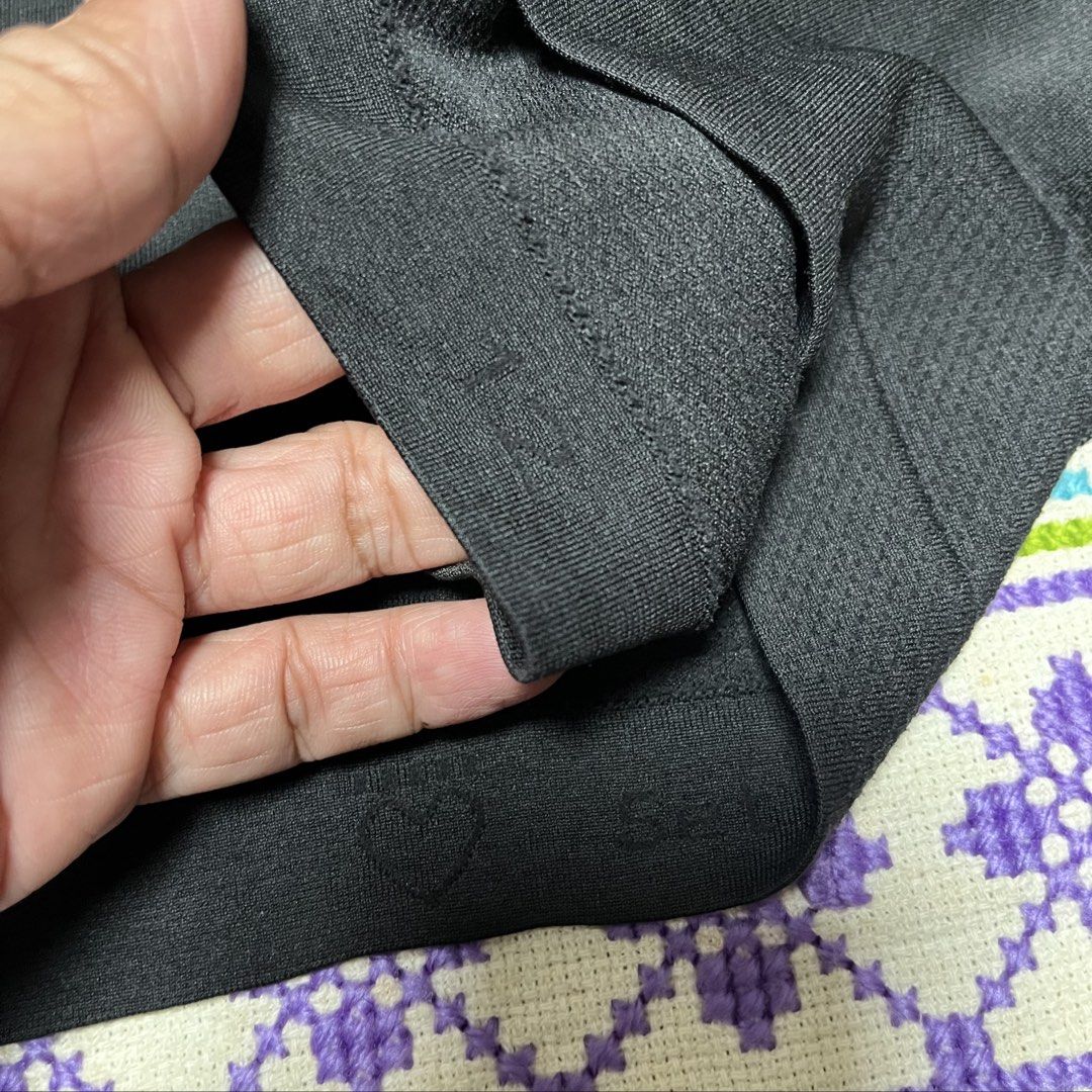 Lululemon Black Racerback Tank Top (Category: Activewear) located in Dagupan City. Submitted by vernzkee (Listing ID 1468525148, Image 3). Description: - Authentic Lululemon racerback tank top in classic black - Seamless, stretchy fabric for ultimate workout comfort - Stylish knit texture patterns along the back and sides - Signature reflective Lululemon logo on the upper back for visibility - Size indicator visible on the inside hem - Ideal for 