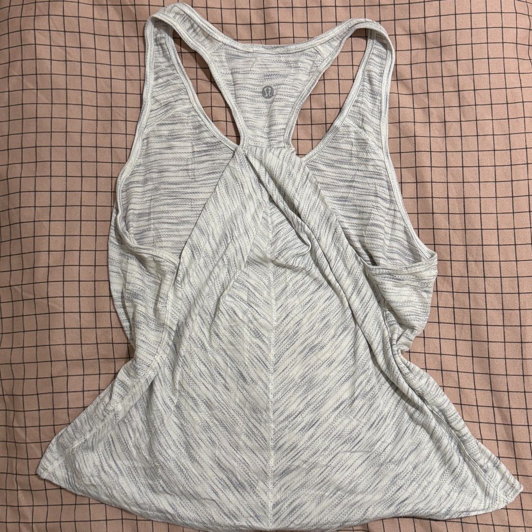 Lululemon grey heathered racerback tank top 🤍 (Category: Activewear) located in Pasay City. Submitted by bellita_05 (Listing ID 1468668270, Image 1). Description: • Colour: Light grey/white heathered • Style: Racerback athletic tank • Logo visible • Size: Tag cut • Measurements: Width 35 cm | Length 20 in • Pre-loved condition Perfect for gym, yoga, pilates, or everyday athleisure wear!.