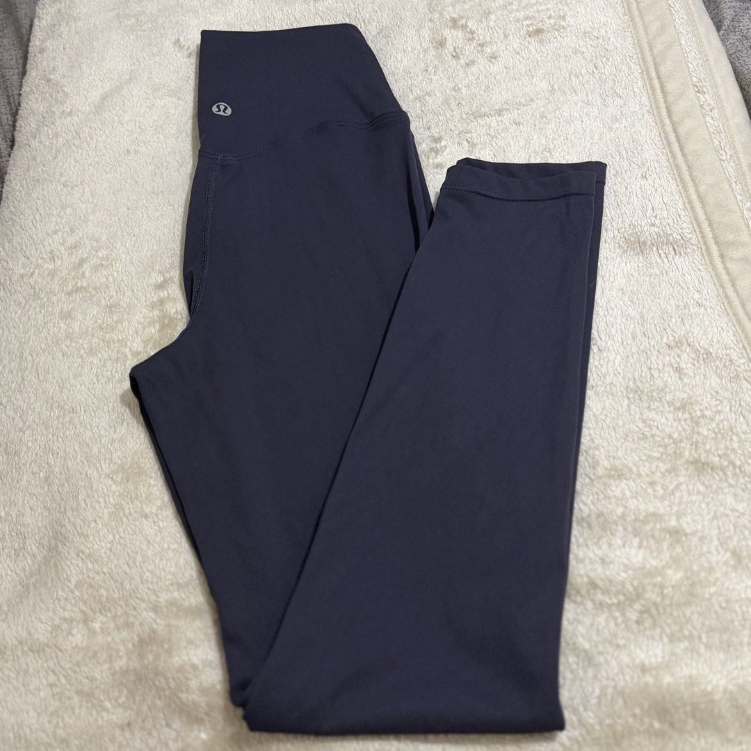 Lululemon High-Waisted Navy Leggings 💙 (Category: Activewear) located in Pasay City. Submitted by bellita_05 (Listing ID 1468654910, Image 1). Description: * Colour: Navy blue * Waist: 27 cm flat, can stretch to 37cm *Length: 32 in * Size: Tag/size dot removed — please refer to measurements * Condition: Pre-loved Please check measurements and issue on the last photo before purchasing..