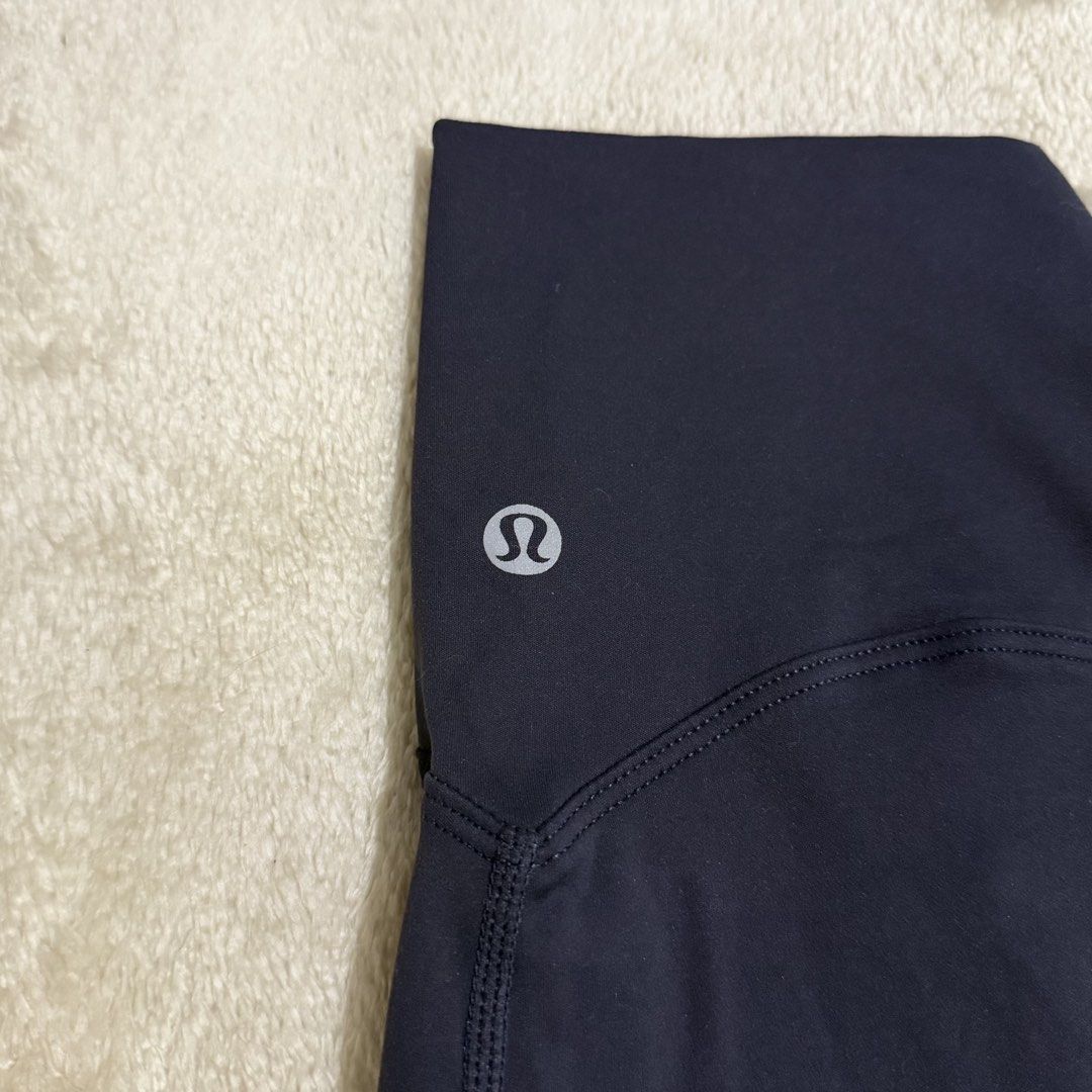Lululemon High-Waisted Navy Leggings 💙 (Category: Activewear) located in Pasay City. Submitted by bellita_05 (Listing ID 1468654910, Image 2). Description: * Colour: Navy blue * Waist: 27 cm flat, can stretch to 37cm *Length: 32 in * Size: Tag/size dot removed — please refer to measurements * Condition: Pre-loved Please check measurements and issue on the last photo before purchasing..