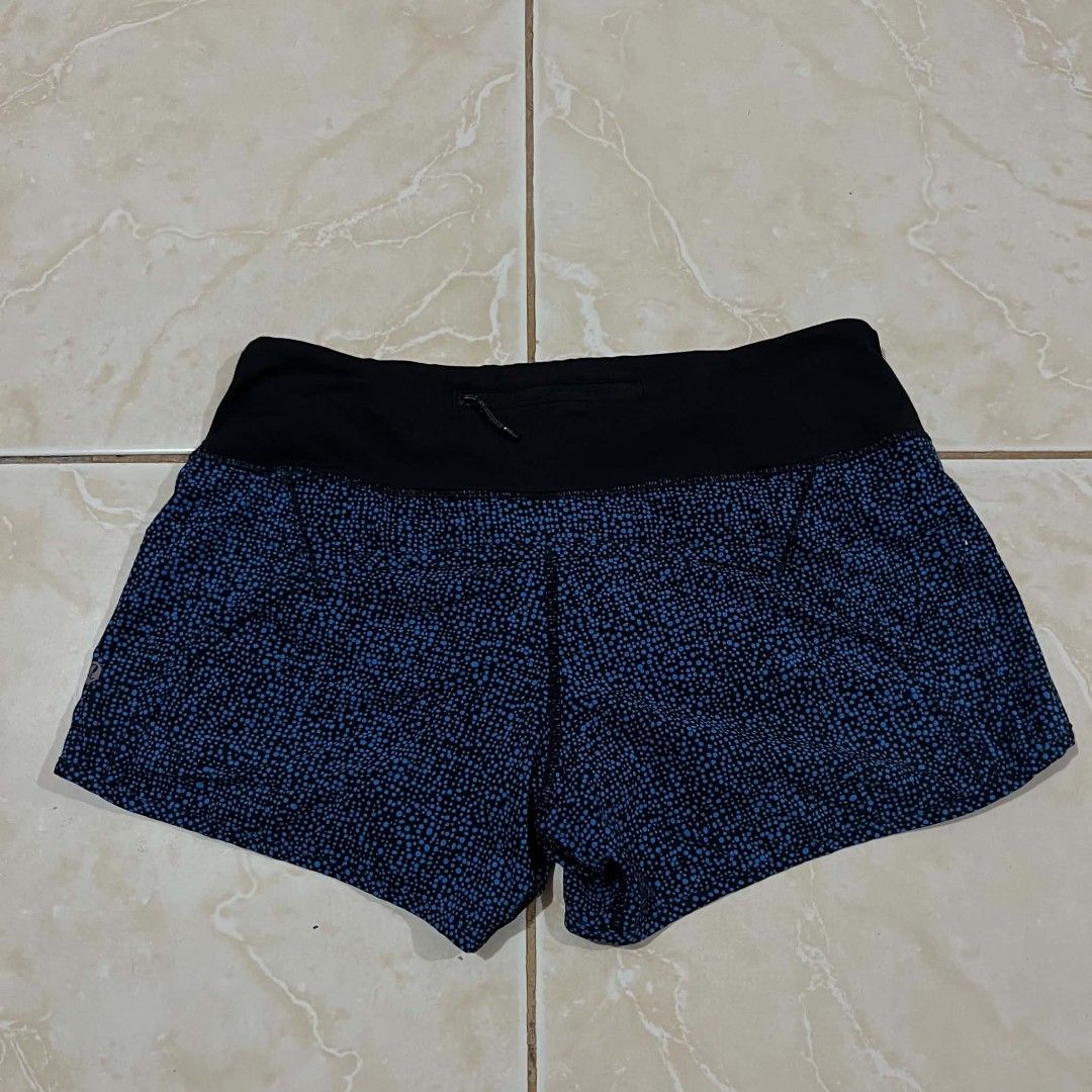 Lululemon Speed Up Shorts Blue Black Dot Pattern Size 6 (Category: Shorts) located in Cagayan de Oro. Submitted by pretiezt2001 (Listing ID 1468685959, Image 2). Description: - Brand: Lululemon - Design: Black with a stylish blue dot pattern and bright blue inner lining - Waistband: Wide black waistband with a secure back zip pocket for essentials - Details: Signature Lululemon logo on the lower left leg - Material: Lightweight, breathable, and c