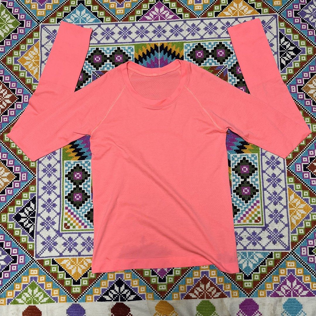 Lululemon Swiftly Tech Long Sleeve Pink (Category: Longsleeves) located in Dagupan City. Submitted by vernzkee (Listing ID 1468522290, Image 2). Description: Dot 4 check last pic for flaw Not too noticeable when worn - Brand: Lululemon - Color: Bright pink - Features: Seamless breathable knit fabric, thumbholes on cuffs, reflective logo on back collar - Condition: Lightweight activewear with a minor spot near the bottom hem - Ideal for: Gym, runn