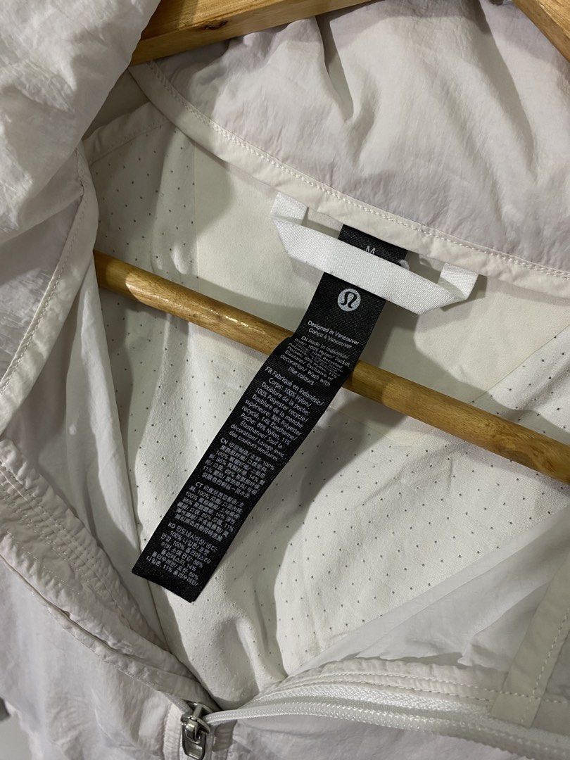 Lululemon White Lightweight Windbreaker Jacket Size M (Category: Coats, Jackets and Outerwear) located in Manila. Submitted by castromerb32733 (Listing ID 1468630061, Image 2). Description: Lululemon windbreaker Packable hood 23.5x25 Need wash.