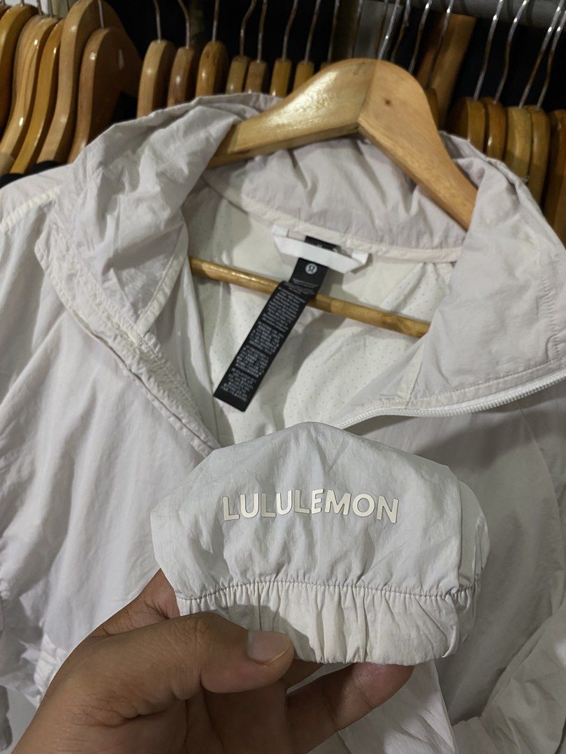Lululemon White Lightweight Windbreaker Jacket Size M (Category: Coats, Jackets and Outerwear) located in Manila. Submitted by castromerb32733 (Listing ID 1468630061, Image 3). Description: Lululemon windbreaker Packable hood 23.5x25 Need wash.