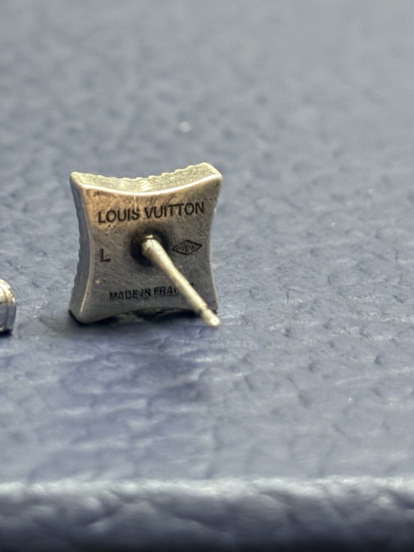 LV Whisper Earrings (Category: Luxury Accessories) located in Imus. Submitted by LUXunBOX (Listing ID 1468655793, Image 3). Description: M03666 LV Whisper Earrings Constructed from versatile sterling silver, the LV Whisper stud earrings brim with nuance and mood. The pairing of a Monogram Flower and a set of LV Initials is rendered in dramatic relief, sculpted and finished with black. This intriguing collection of details enhances daily wear. 1.5