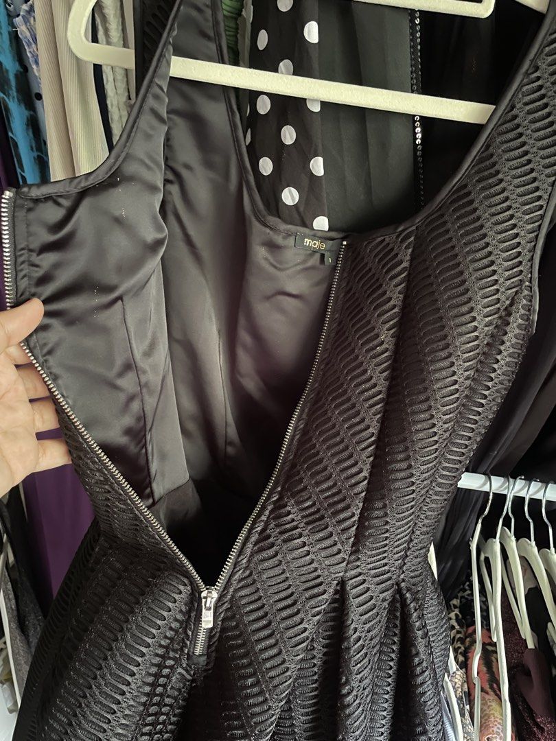 Maje Dress (Category: Dresses) located in Dumaguete. Submitted by jaymharr (Listing ID 1468514665, Image 3). Description: This is the MAJE Gulliver Fit & Flare Mesh Dress, a sleeveless black mini dress featuring a textured wafer-mesh overlay, a fitted bodice, an exposed front zipper, and a pleated flared A-line skirt..