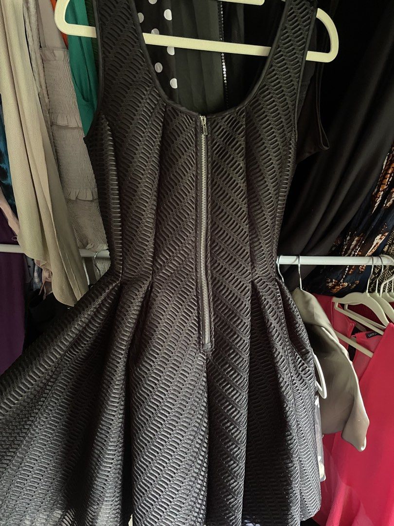 Maje Dress (Category: Dresses) located in Dumaguete. Submitted by jaymharr (Listing ID 1468514665, Image 2). Description: This is the MAJE Gulliver Fit & Flare Mesh Dress, a sleeveless black mini dress featuring a textured wafer-mesh overlay, a fitted bodice, an exposed front zipper, and a pleated flared A-line skirt..