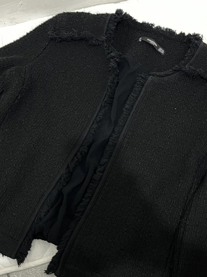 Mango Black Tweed Jacket (Category: Coats, Jackets and Outerwear) located in Manila. Submitted by lai.p (Listing ID 1468503793, Image 2). Description: - Brand/Style: Mango black tweed jacket - Design: Open front with stylish frayed trim edges - Neckline & Sleeves: Classic round neckline and long sleeves - Interior: Fully lined for comfort - Versatility: Perfect layering piece for office wear or casual outings - Sizing: Refer to collar label photo