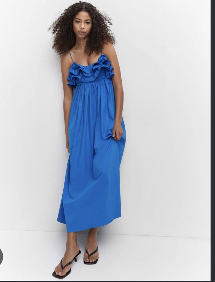 Mango Blue Ruffled Midi Dress with Spaghetti Straps (Category: Dresses) located in Munoz. Submitted by Liiz27 (Listing ID 1468595385, Image 2). Description: - Color: Bright blue - Style: Midi length dress with flowy pleated skirt - Details: Ruffled neckline and thin spaghetti straps - Material: Lightweight, breathable cotton (great for the PH weather!) - Fit: Easy pull-on style.