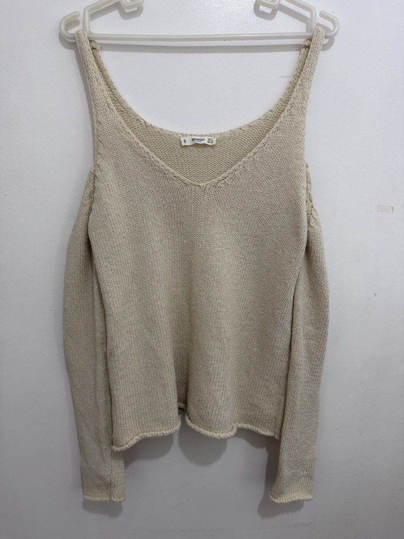 Mango Casual Cold Shoulder Knit Sweater (Category: Longsleeves) located in Malolos. Submitted by eadiana (Listing ID 1468537129, Image 1). Description: - Brand: Mango Casual - Size: EUR S / USA XS / MEX CH - Color: Versatile neutral cream - Material/Texture: Cozy ribbed knit - Design: Cold shoulder cutout, long sleeves, and V-neckline - Origin: Made in Turkey - Condition: Great wardrobe staple, easy to dress up or down.