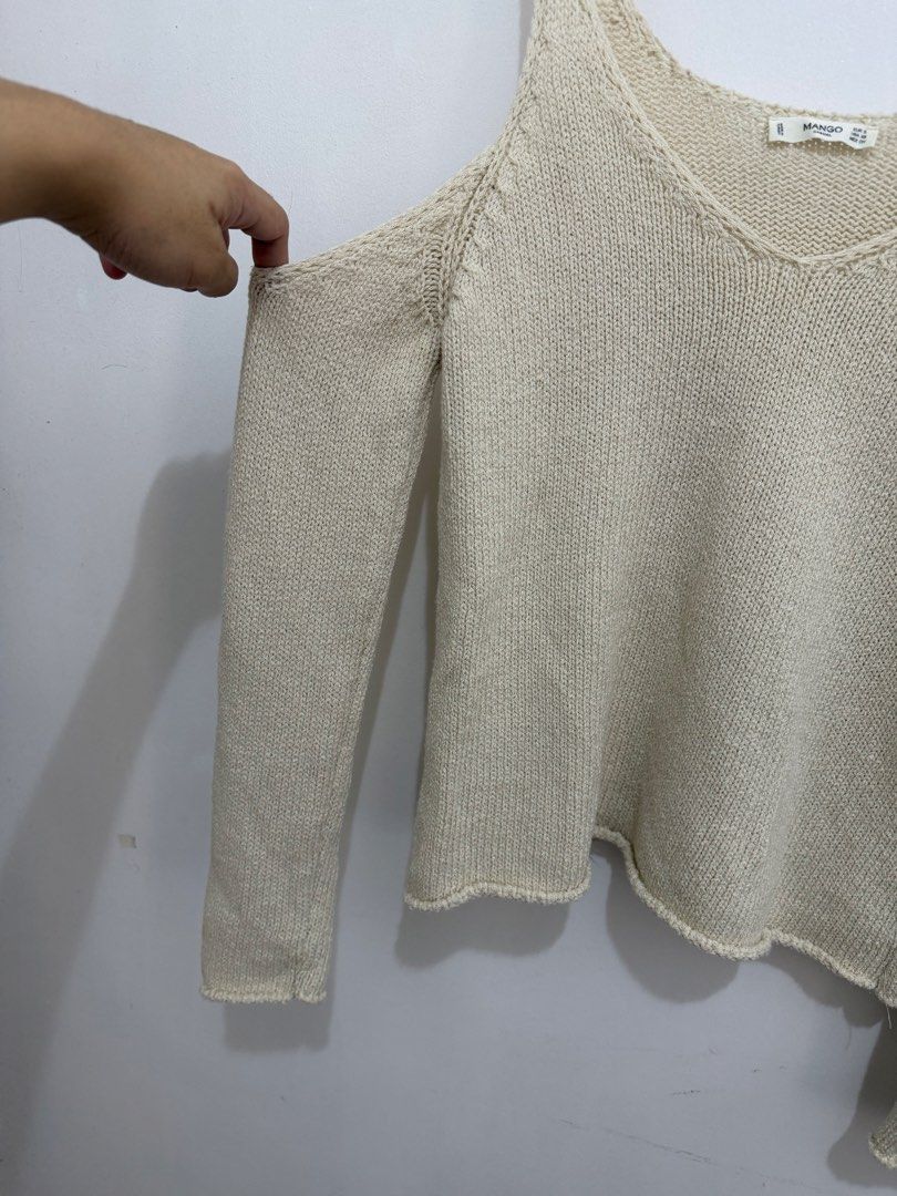 Mango Casual Cold Shoulder Knit Sweater (Category: Longsleeves) located in Malolos. Submitted by eadiana (Listing ID 1468537129, Image 3). Description: - Brand: Mango Casual - Size: EUR S / USA XS / MEX CH - Color: Versatile neutral cream - Material/Texture: Cozy ribbed knit - Design: Cold shoulder cutout, long sleeves, and V-neckline - Origin: Made in Turkey - Condition: Great wardrobe staple, easy to dress up or down.