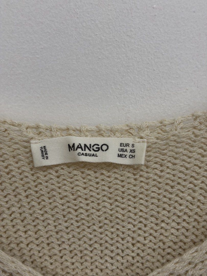 Mango Casual Cold Shoulder Knit Sweater (Category: Longsleeves) located in Malolos. Submitted by eadiana (Listing ID 1468537129, Image 2). Description: - Brand: Mango Casual - Size: EUR S / USA XS / MEX CH - Color: Versatile neutral cream - Material/Texture: Cozy ribbed knit - Design: Cold shoulder cutout, long sleeves, and V-neckline - Origin: Made in Turkey - Condition: Great wardrobe staple, easy to dress up or down.
