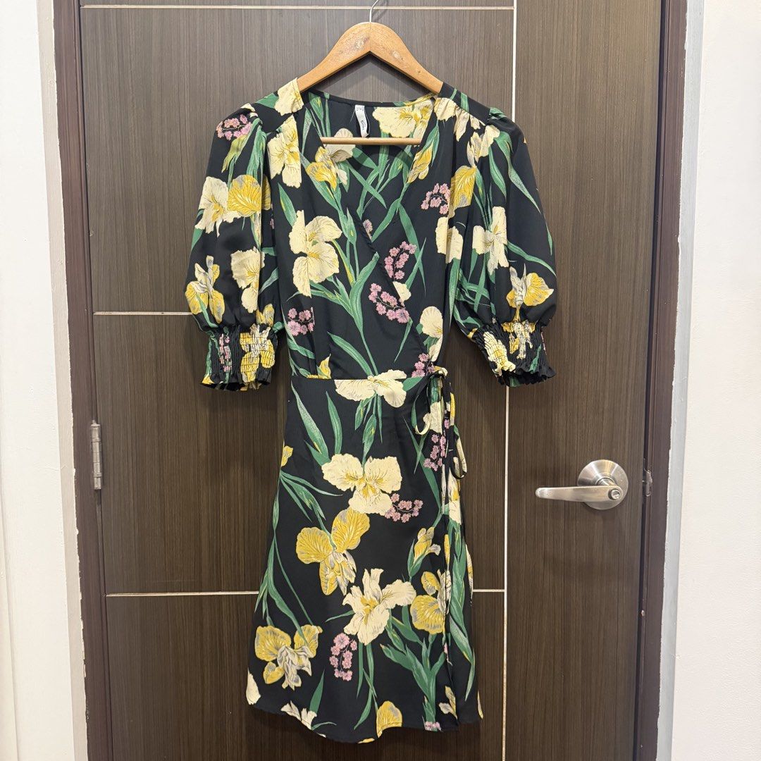 Mango Floral Wrap Dress (Category: Dresses) located in Marikina City. Submitted by lou.and.trio (Listing ID 1468693159, Image 2). Description: LAST PRICE AS POSTED - Condition: Worn once only - Style: Wrap dress with tie side waist detail - Color/Pattern: Black with yellow, green, and pink floral print.