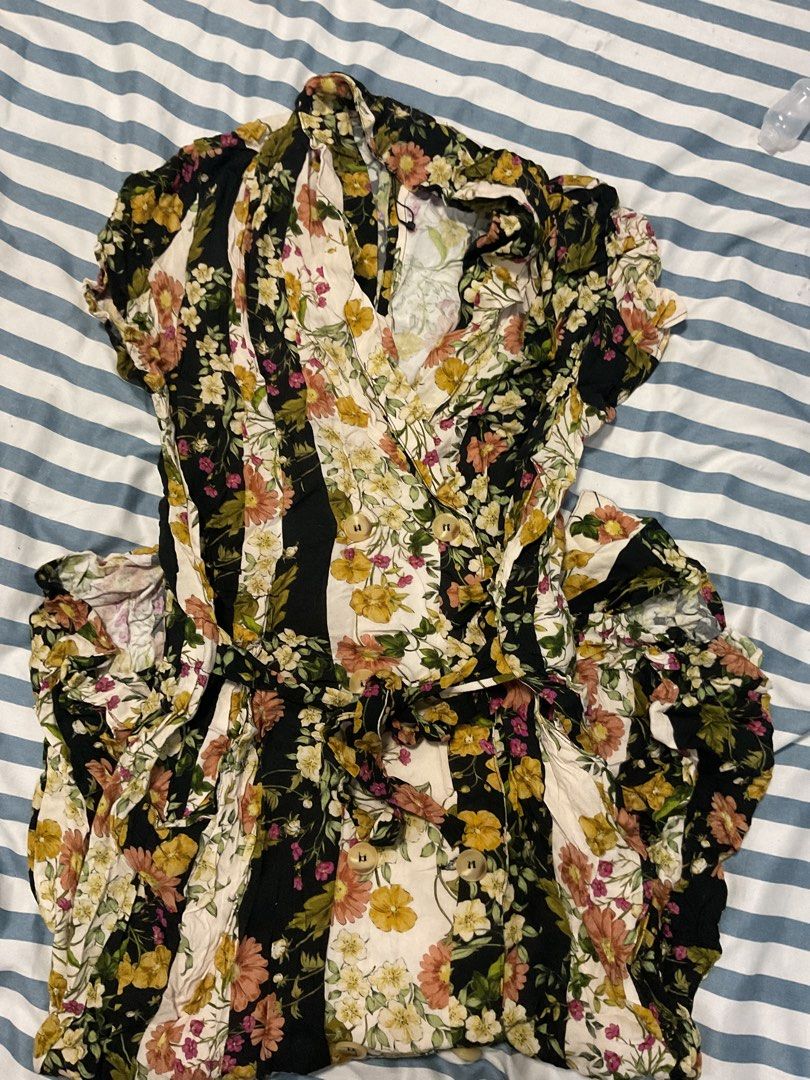 Mango Floral Wrap Midi Dress Size L (Category: Dresses) located in Candelaria. Submitted by azielkob (Listing ID 1468562479, Image 2). Description: - Brand: Mango - Style: Floral midi dress with vertical stripes - Details: Short sleeves, lapel collar, double-breasted button front, matching fabric waist tie belt - Color Palette: Black, white, yellow, and pink - Fabric: Viscose - Size: Large on tag .