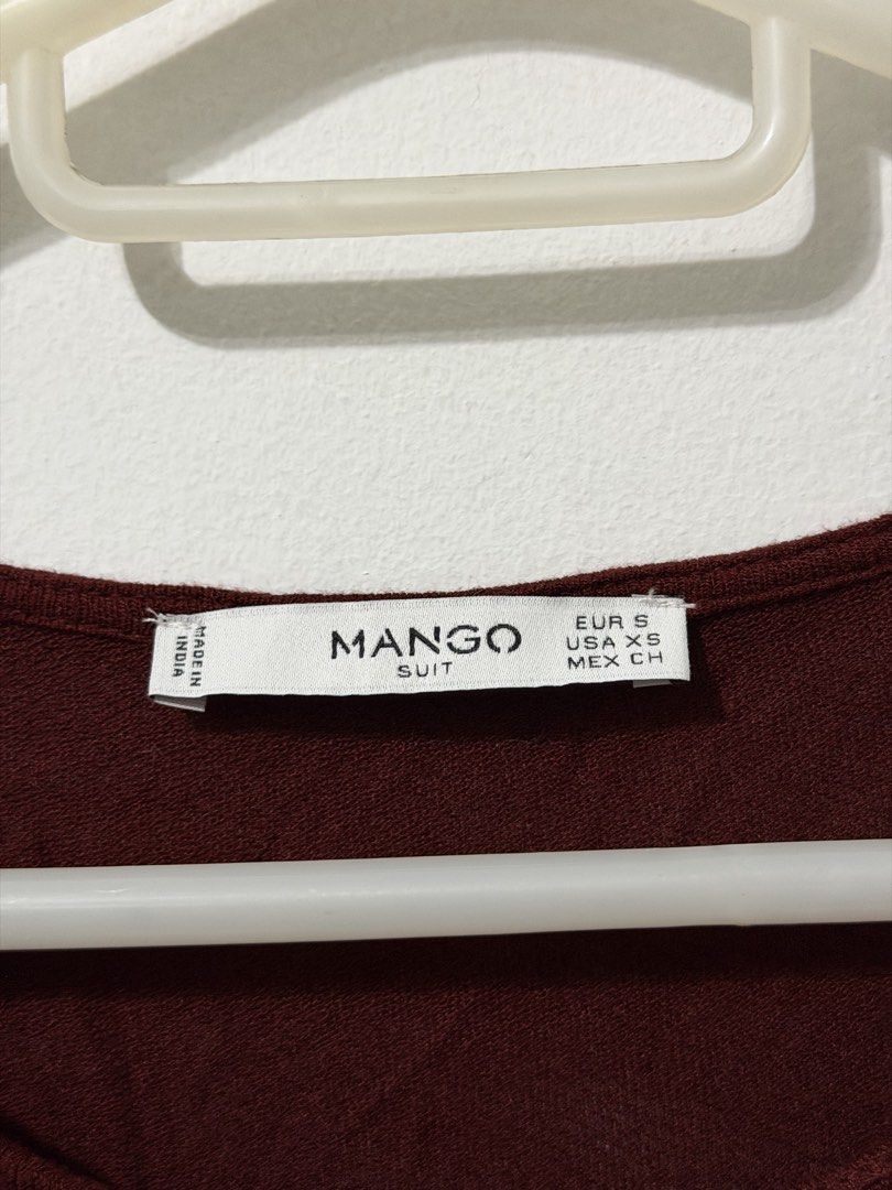 Mango Suit Boho Dress (Category: Dresses) located in Malolos. Submitted by eadiana (Listing ID 1468576004, Image 2). Description: - flaw ‼️: small hole as shown on photo - Brand/Style: Mango Suit tunic dress - Color: Deep Maroon - Size: EUR S / USA XS - Details: Detailed embroidery with tassel ties, lace panels on front and sides - Sleeves: Long sleeves with flared cuffs - Hemline: High-low hem - Material: Lightweight, comfortable fabric - Condit