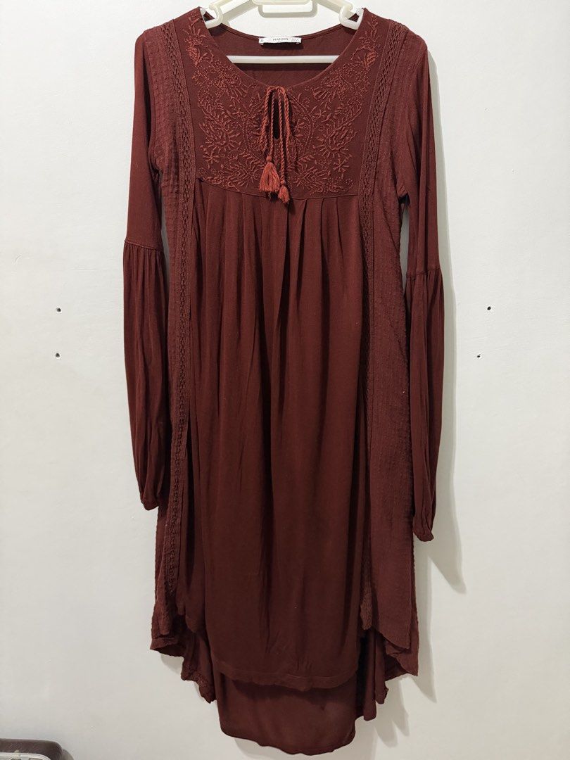 Mango Suit Boho Dress (Category: Dresses) located in Malolos. Submitted by eadiana (Listing ID 1468576004, Image 1). Description: - flaw ‼️: small hole as shown on photo - Brand/Style: Mango Suit tunic dress - Color: Deep Maroon - Size: EUR S / USA XS - Details: Detailed embroidery with tassel ties, lace panels on front and sides - Sleeves: Long sleeves with flared cuffs - Hemline: High-low hem - Material: Lightweight, comfortable fabric - Condit