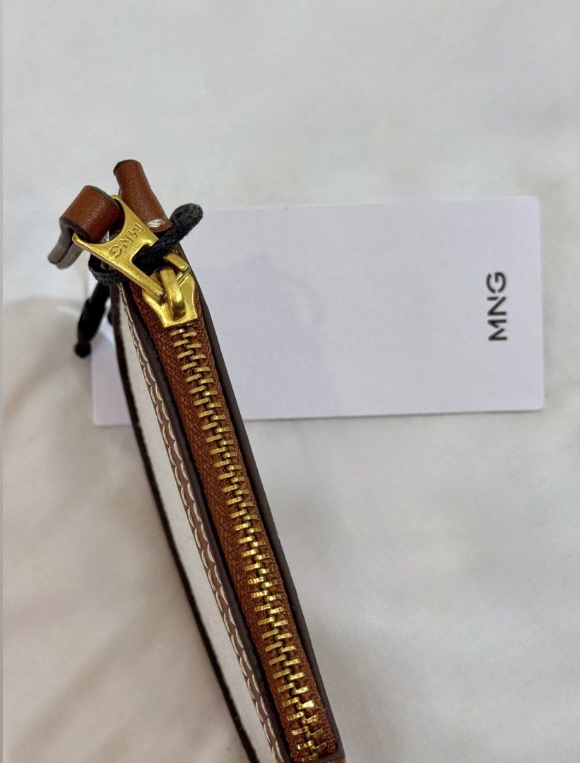 Mango Wallet (Category: Wallets & Card holders) located in Quezon City. Submitted by shopper_xoxo (Listing ID 1468513325, Image 3). Description: Brand new with tag 😊 📦 From Zara Japan 🚚 On hand and ready to ship MOP: GCash and BPI Shipping starts at ₱65 only ✨ .