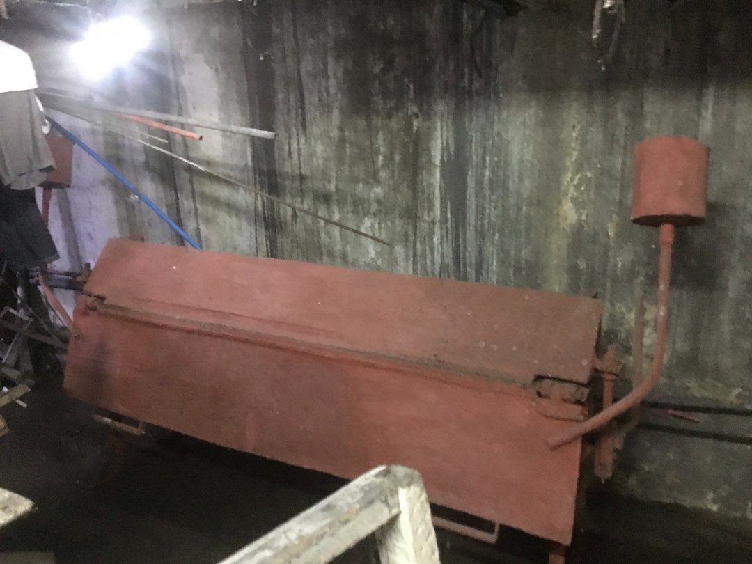 Manual Sheet Metal Bending Machine Folder (Category: Construction Tools & Equipment) located in Manila. Submitted by roberto.enriquez (Listing ID 1468689511, Image 1). Description: - Heavy-duty manual metal brake, ideal for workshop fabrication and sheet metal bending - Solid and sturdy construction finished in reddish-brown paint - Equipped with two side counterweight handles and manual leverage operation - Condition: Shows some wear, surface ru