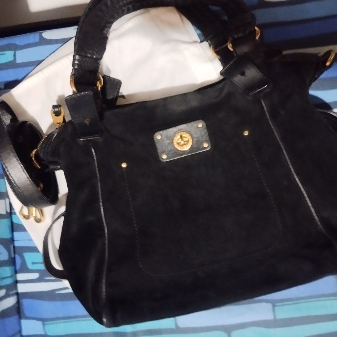 Marc by Marc Jacobs Black Suede Bag (Category: Cross-body Bags) located in Manila. Submitted by lene48 (Listing ID 1468644584, Image 2). Description: - Brand: Marc by Marc Jacobs - Material: Black suede with gold-tone hardware - Pockets: Front turnlock pocket - Straps: Double top handles and a detachable strap - Interior: Black and cream logo fabric lining - Condition: Clean, great everyday size.