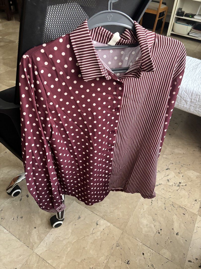 Maroon Polka Dot and Striped Long Sleeve Button-Down Blouse (Category: Blouses) located in Bacolod City. Submitted by theresuhhhh (Listing ID 1468553542, Image 2). Description: - Unique mixed-pattern design: polka dots on one side, vertical stripes on the other - Color: Rich maroon and white - Features: Button-up front, pointed collar, long sleeves with button cuffs - Fabric: Lightweight and slightly sheer - Versatile: Easy to style for work or c